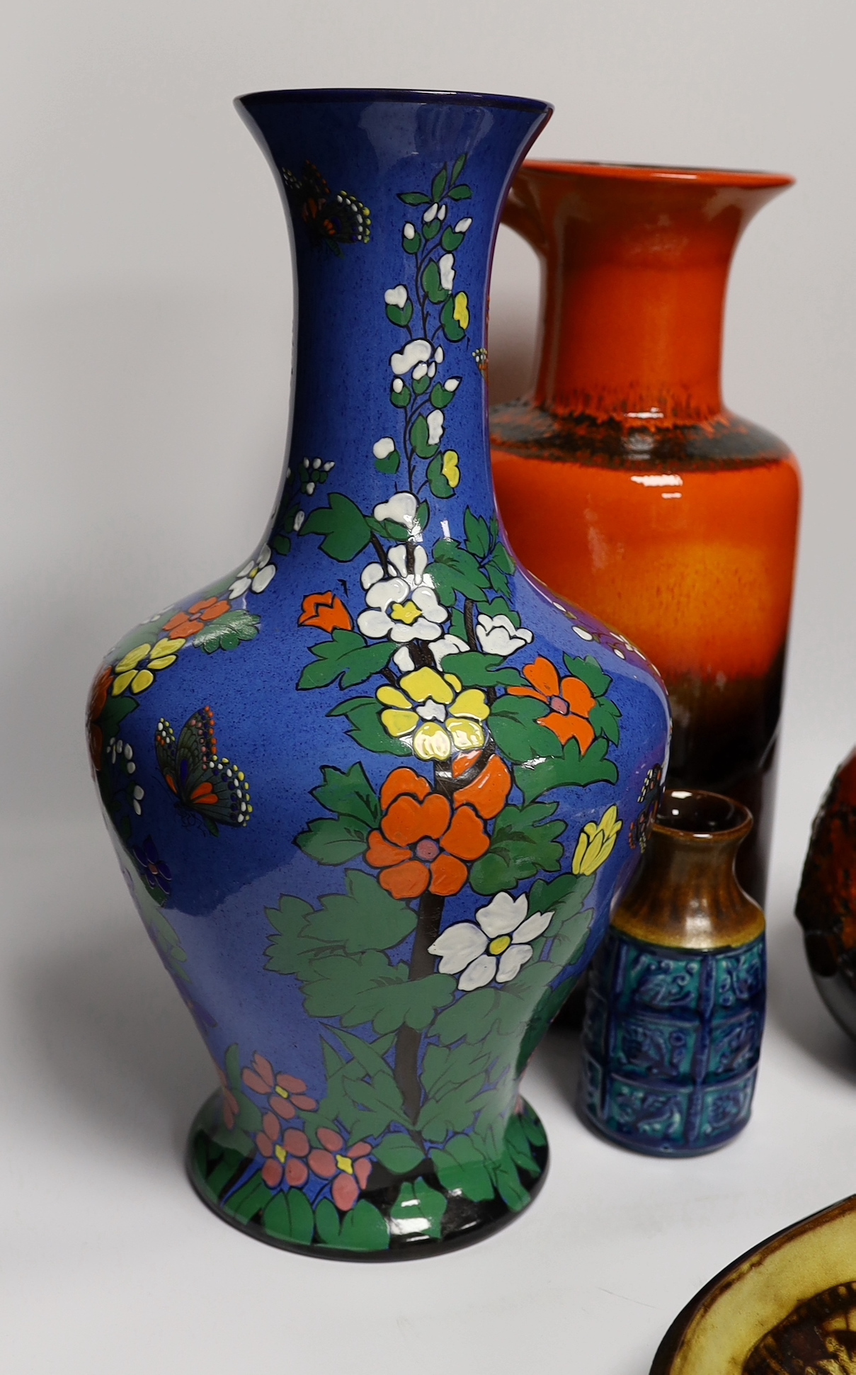 Five mid century pottery pieces including a Joyce Morgan 'cat' tray, an Adderley blue ground vase, and three W. German vases including 'Fat Larva' vase, tallest 42cm